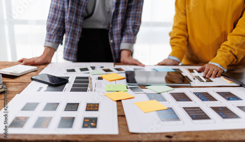 Cuadro en lienzo Experienced uxui designers actively developing a mobile app interface, reviewing