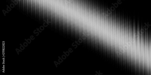Konstfotografi A dark background with a diagonal silver metallic texture, resembling brushed metal or polished steel, creating a sleek and modern abstract design
