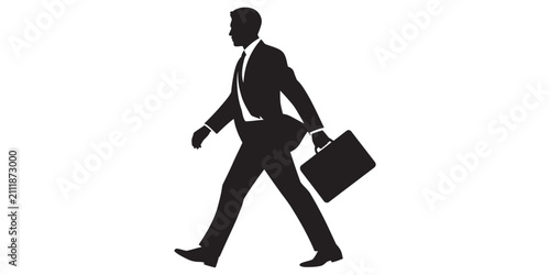 Obraz na płótnie Silhouette of a businessman in a suit walking with a briefcase