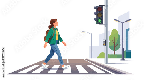 Young woman walking across street on zebra crosswalk at green light.