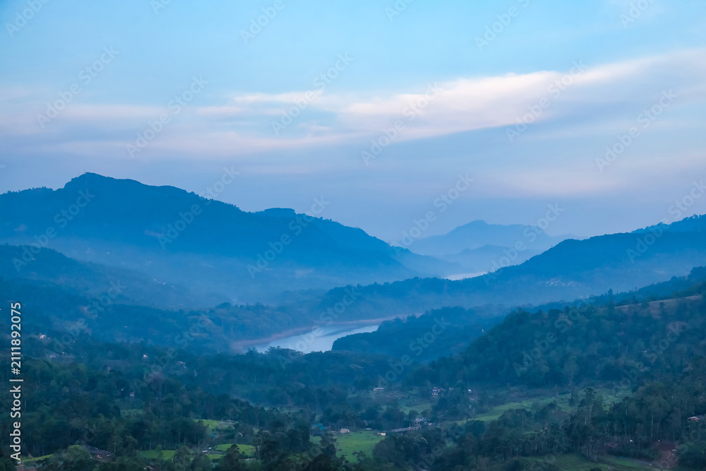 Fototapeta premium Mountain Range Landscape in Sri Lanka With Lush Forests and Morning Mist