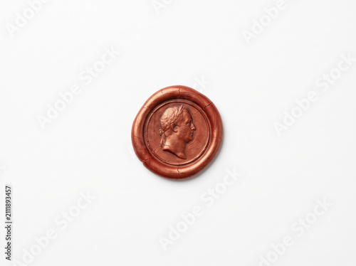 Red wax seal with a vintage profile portrait of a man