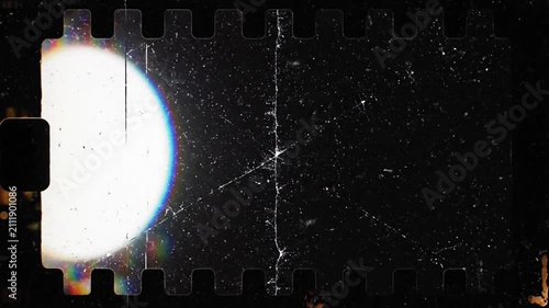 Vintage film strip frame with bright light leak effect.