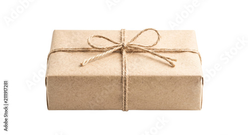 Фотография Simple brown paper package tied with natural twine and a bow