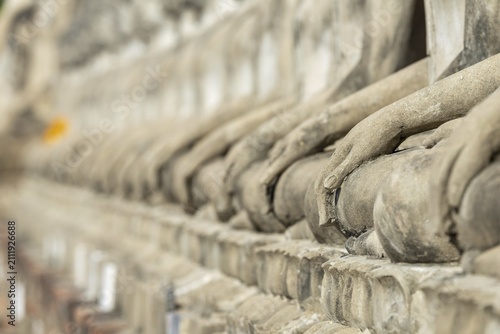 Row of Buddha statues (Bhumispara-mudra, Buddha Gautama at the moment of enlightenment), Great Chedi Chaya Mongkol, Wat Yai Chai Mongkon, Ayutthaya, Thailand