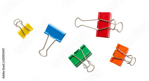 Canvas Print Assortment of colorful binder clips scattered against a clean white background