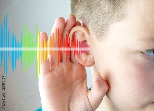 фотографія Closeup caucasian small childs ear, sound wave, Hearing Test, ringing or buzzing