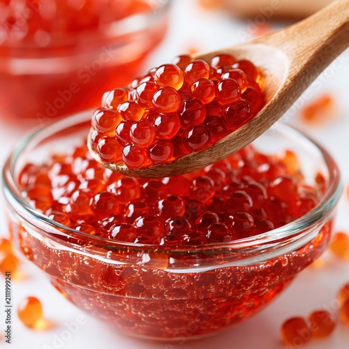 Red Salmon Caviar in Glass Bowl with Wooden Spoon