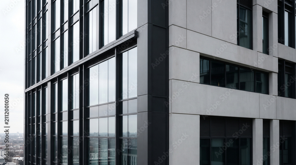 Obraz premium Modern skyscraper facade with glass windows and contemporary architectural structure design
