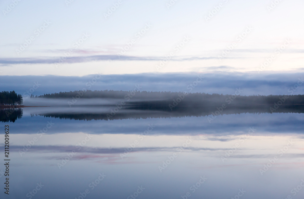 Naklejka premium Foggy landscape in Northern Finland.