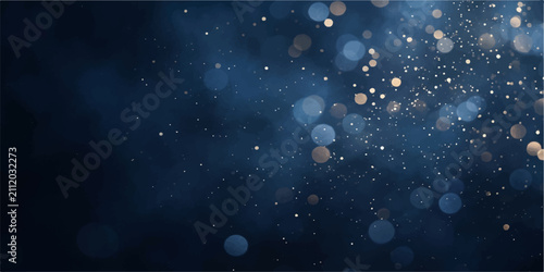 Abstract Bokeh and Dust Particles: A mesmerizing abstract composition featuring a dark blue background illuminated by soft.