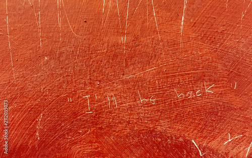 Konstfotografi Mensaje grabado en una pared en inglés: I'll be back