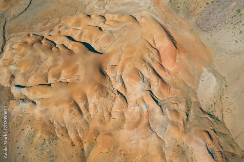Cuadro en lienzo Sweeping aerial view of Altai's eroded, textured terrain with deep shadows and n