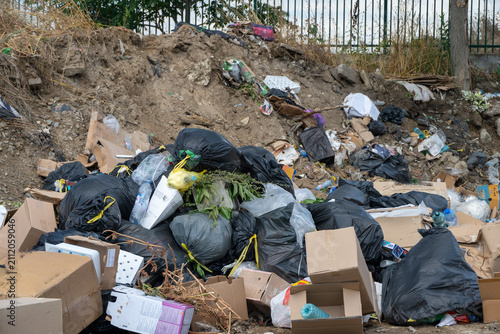 Obraz na plátne a large accumulation of illegally dumped garbage—including black plastic trash b