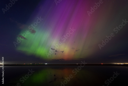 Fotografie Pink and green Northern Lights Aurora Borealis in Dublin, Ireland