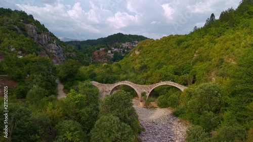 Aerial view of the Plakidas Three-Arched Stone Bridge in Zagori, Epirus, Greece