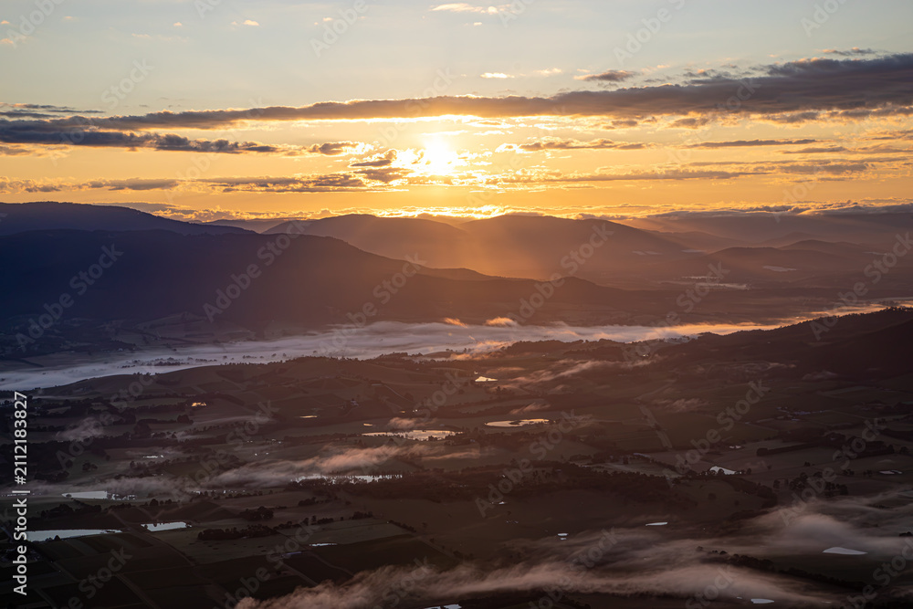 Obraz premium Sunrise over the Yarra Valley with morning fog from a hot air balloon, Victoria, Australia