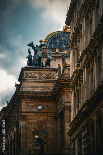 Fotografie Statue of a quadriga and neoclassical architecture in Prague, Czech Republic
