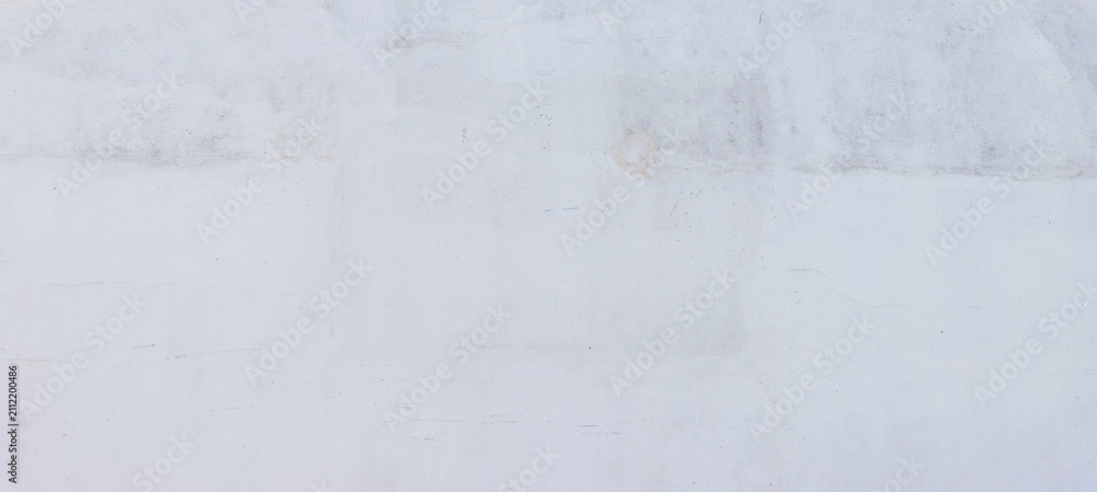 Obraz premium Minimalist off-white painted concrete wall background featuring subtle scratches, faint stains, and soft texture, providing a clean surface for graphic designs and overlays.