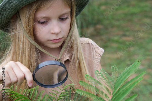 Obraz na płótnie Young Nature Explorer Studying Plants in the Garden