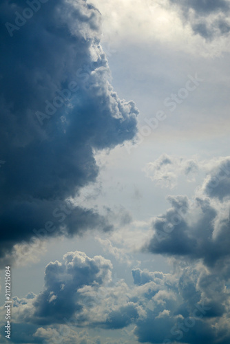 vertical frame with a huge dark storm cloud on the left