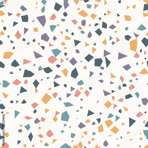 Seamless terrazzo pattern with scattered geometric shapes in pastel and muted colors, perfect for interior design and backgrounds.