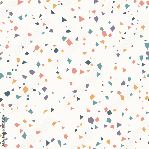 Seamless terrazzo pattern background with scattered geometric shapes in muted pastel colors for design and decor