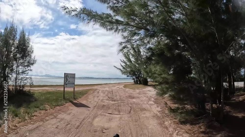 POV Buggy Ride Along a Sandy Road Beside a Coastal Lagoon in Arubinha, Brazil