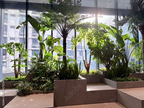 Принти на полотні Lush indoor garden garden arrangement in modern office atrium