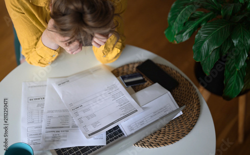 Картината върху платно Stressed woman having financial problems with paying bills.