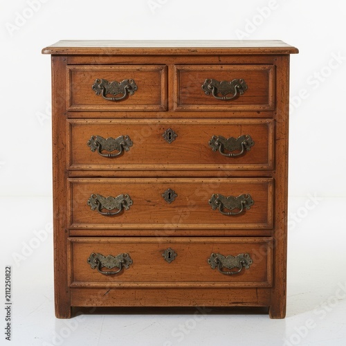 Vintage wooden dresser with ornate metal drawer handles