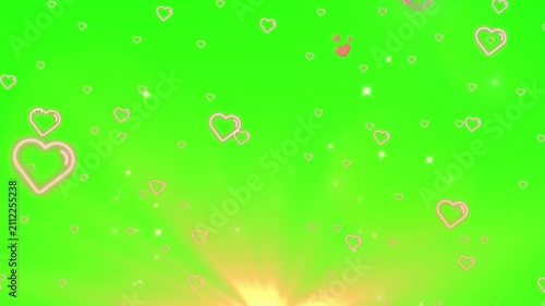 Floating pink hearts rising with sparkling light effects against vibrant green screen background with continuous upward movement shimmering light particles video continuous