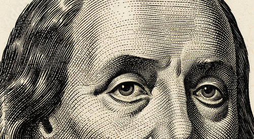 Close-up engraving of Benjamin Franklin's face, a Founding Father of the United States.