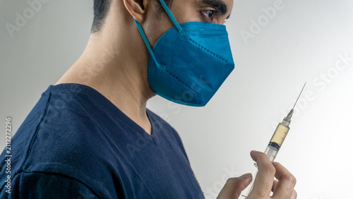 Slika na platnu Close-up of a doctor or nurse preparing a syringe—concept of healthcare, vaccination, medical preparation, patient safety, and clinical professionalism