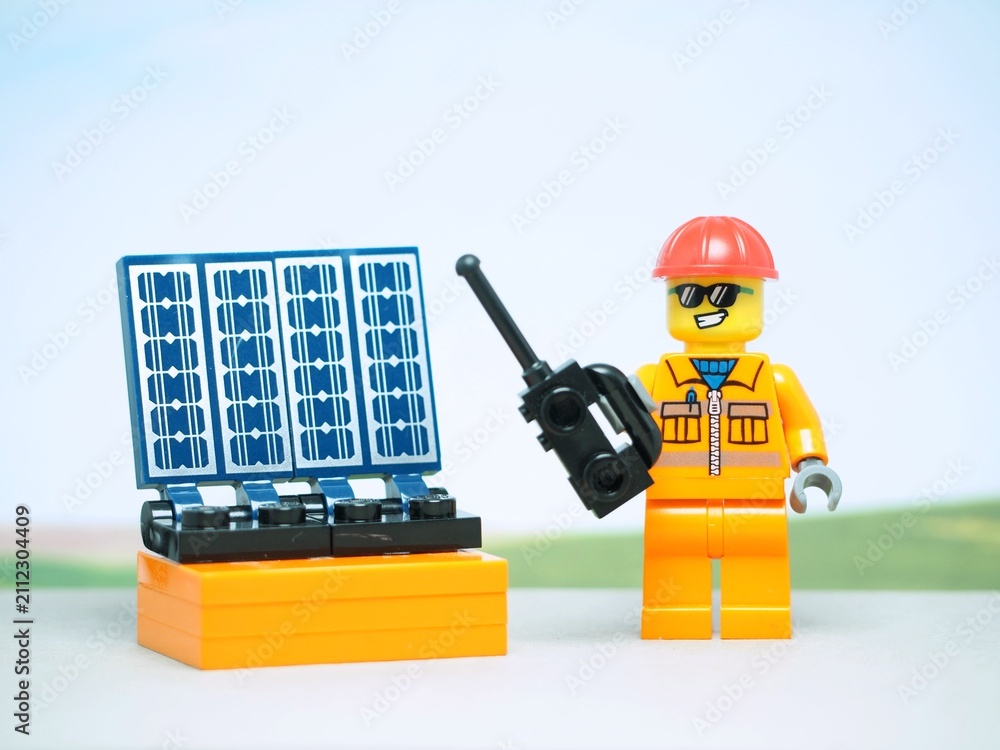 Fototapeta premium Indonesia - August 24, 2023 : Mini toy at outdoor with blurred background. Solar Cell concept design.