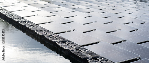 Foto Solar cells in solar farms on surface mounting management on water, alternative