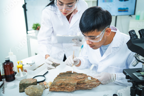 фотографія Scientist laboratory rock sample microscope geology research protective eyewear