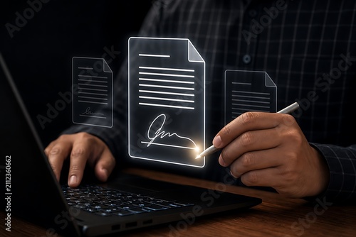 Business person signing digital document on laptop with holographic interface in dark office