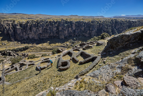 T'aqrachullo rises like a forgotten city carved into stone. Spread across seventeen hectares of windswept mesa in Espinar, Cusco, this ancient citadel holds nearly six hundred structures 