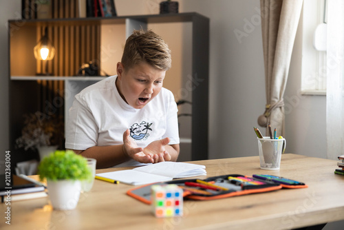 Photos Boy feeling stressed, frustrated, and overwhelmed by schoolwork and learning dif