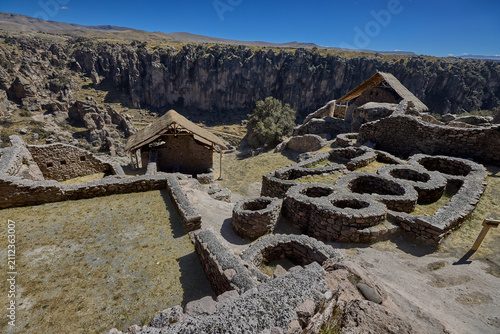 T'aqrachullo rises like a forgotten city carved into stone. Spread across seventeen hectares of windswept mesa in Espinar, Cusco, this ancient citadel holds nearly six hundred structures 