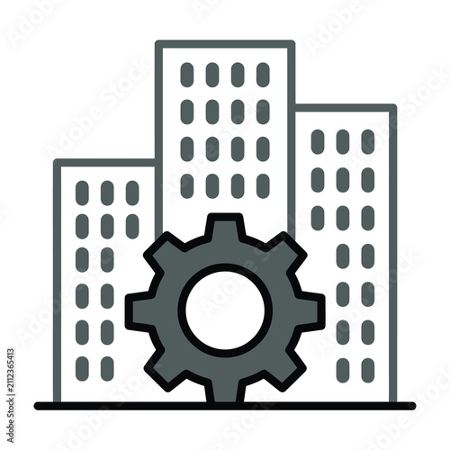 Gear in front of city skyline buildings industrial concept