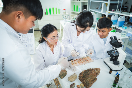 Photography Laboratory scientist student microscope rock sample geology research team examin