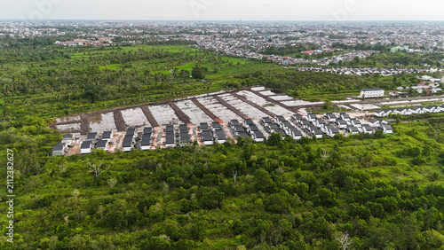 Obraz na plátne Aerial view of residential areas, ongoing construction, and land clearing for ne