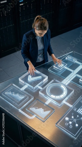 Woman managing data on futuristic interface in server room