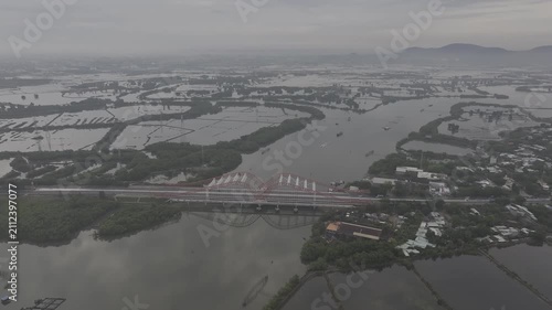 Aerial drone footage of oyster farming in Long Son, Ho Chi Minh City, Vietnam, showcasing traditional aquaculture, floating oyster farms, coastal fishing industry and sustainable seafood production.