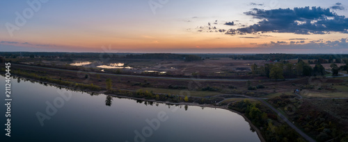 Elevated view over Crandell lake and new gravel quarry at sunrise