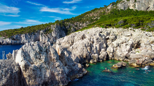 Cuadro en lienzo Stunning aerial perspective of Capri Faro beach with bathers enjoying clear Medi