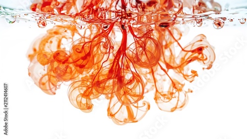 Red ink dispersing in water with swirling patterns and bubbles. abstract art, fluid dynamics, color mixing, liquid flow. The concept of ink diffusion and liquid art.