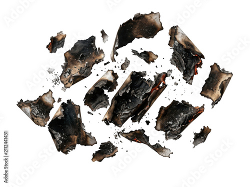 Scattered pieces of burnt paper and ash isolated on transparent background. Perfect for destruction concepts and.